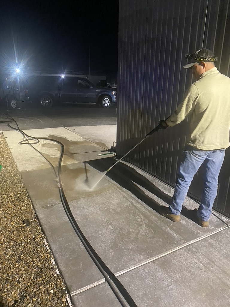 Freedom Cleaning Services, Serving Yuma County, AZ, power-washing a sidewalk.